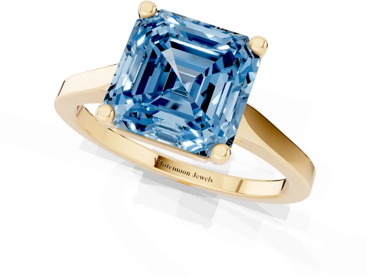 Fancy Blue Asscher Cut Solitaire Diamond Ring with Four-Prong Setting and Tapered Band Yellow gold