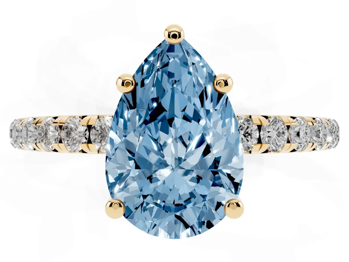 Fancy Blue Pear Cut Cut Diamond Solitaire Ring with Micro Pave Band and Four Prong Setting Yellow gold