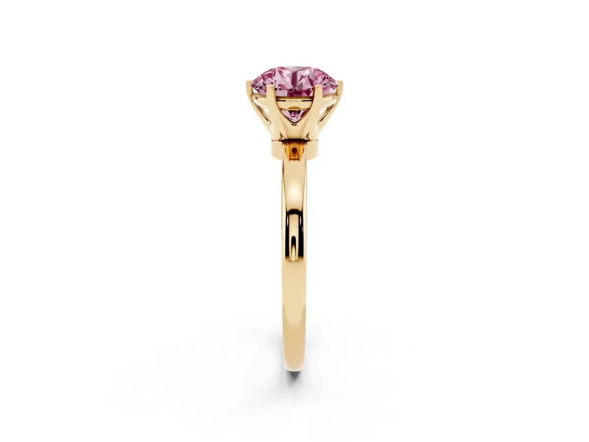Fancy Pink Round Cut Solitaire Diamond Ring with Six-Prong Setting on a Classic Band Yellow gold