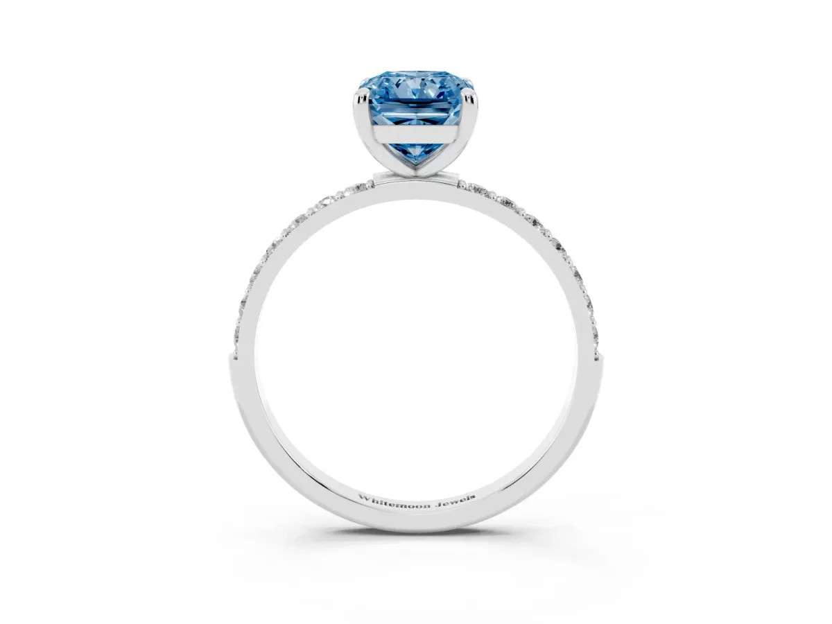 Fancy Blue Radiant Cut Diamond Solitaire Ring with Round Pavé Band and Prong Setting Silver