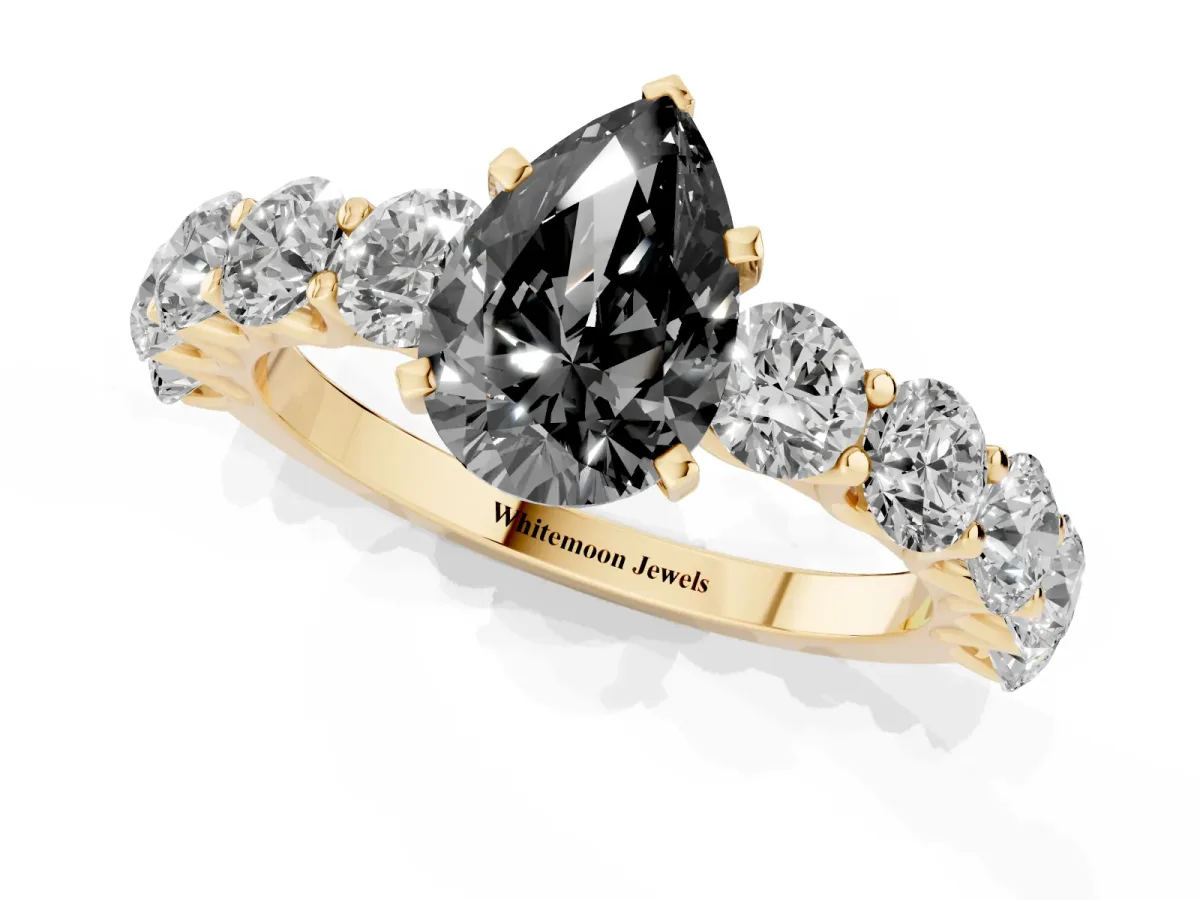 Fancy Black Pear Cut Diamond Prong Setting with Side Stones on a Pave Band Yellow gold