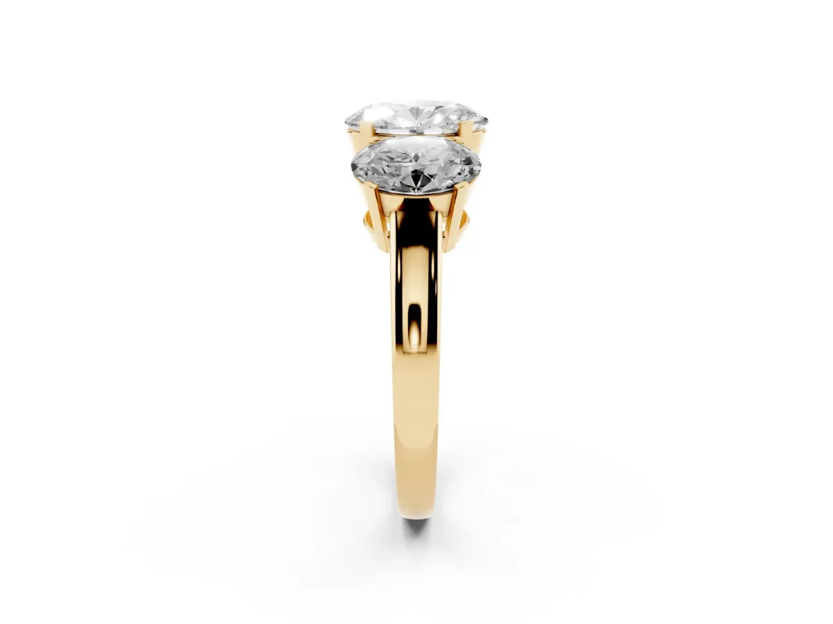 Three-Stone Oval Cut Cut Diamond Ring with Channel Set Band and Four-Prong Setting Yellow gold