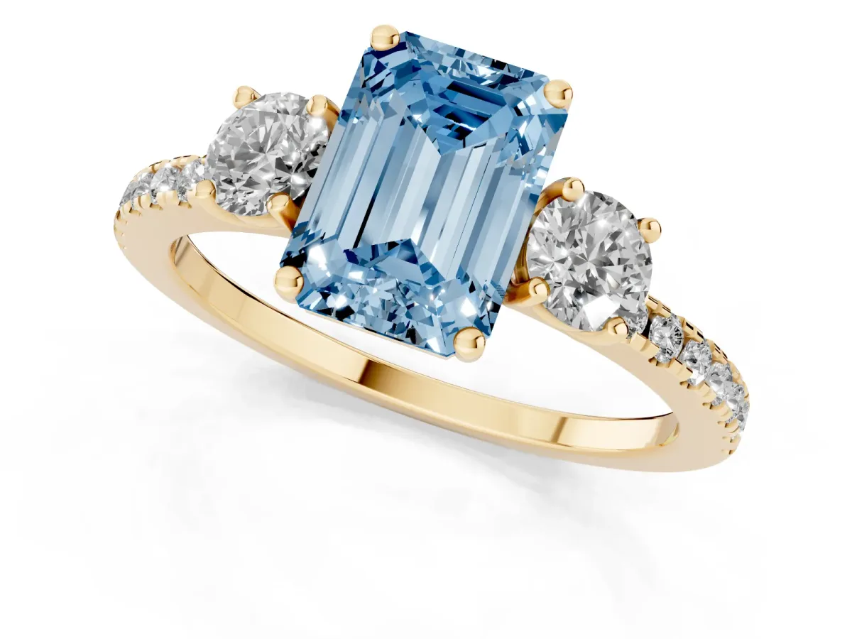 Fancy Blue Three-Stone Emerald Cut Cut Diamond Pavé Band with Prong Setting Yellow gold