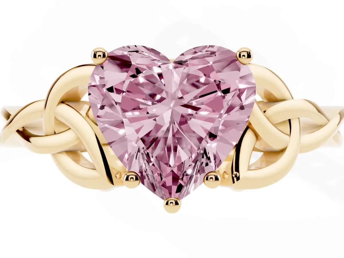 Fancy Pink Heart Cut Diamond Solitaire Engagement Ring with Celtic Knot Band and Four-Prong Setting Yellow gold