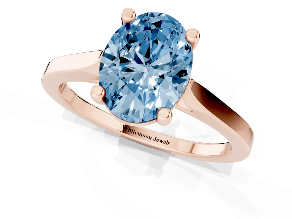 Fancy Blue Oval Cut Solitaire Diamond Ring with Four-Prong Setting and Tapered Band Rose gold