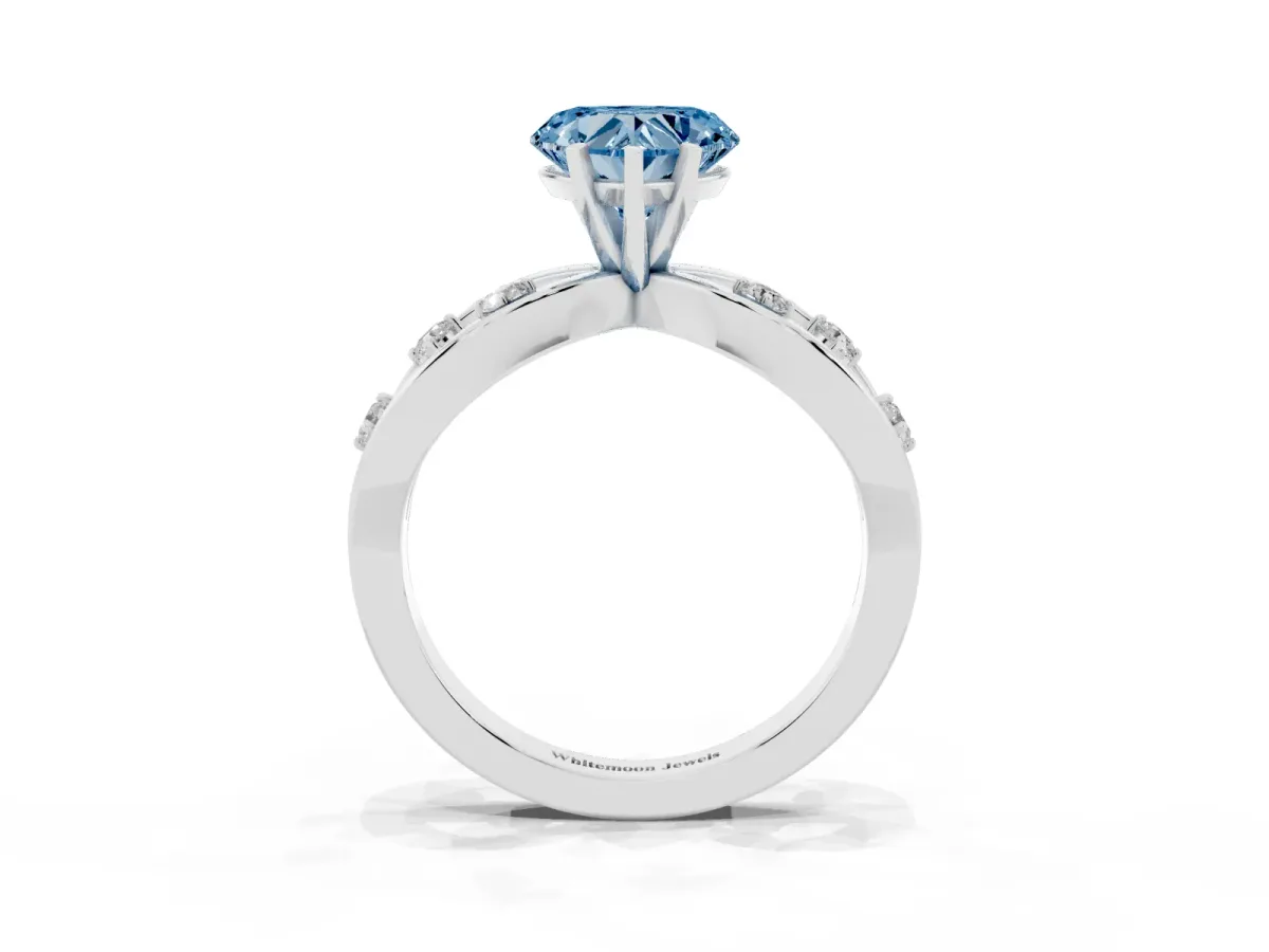 Fancy Blue Heart Cut Cut Solitaire Diamond with Side Stones on Criss-Cross Band and Four-Prong Setting Silver