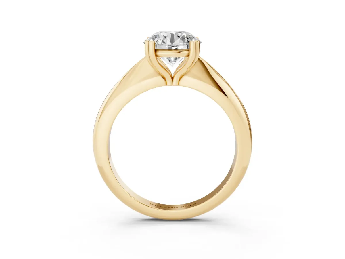 Round Cut Cut Solitaire Engagement Ring with Tapered Band and Four-Prong Setting Yellow gold