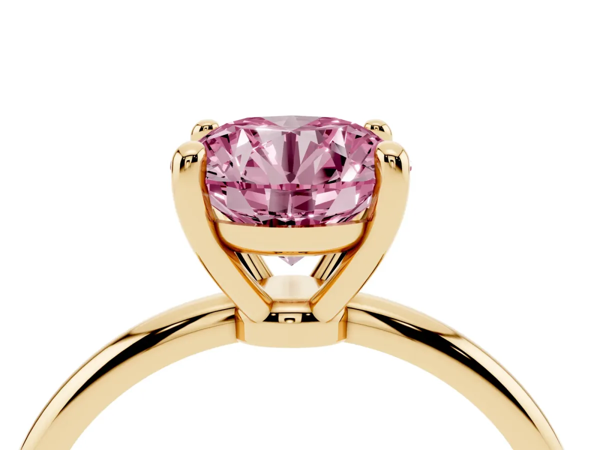 Fancy Pink Round Cut Solitaire Diamond Ring with 4-Prong Setting on a Classic Band Yellow gold