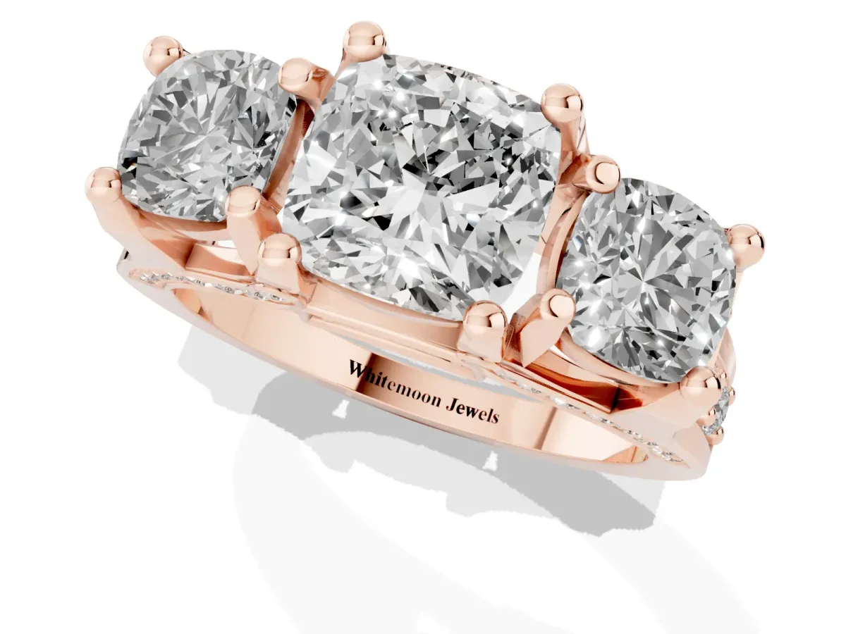 Cushion Cut Diamond Three-Stone Ring with Channel Set Band and Four-Prong Setting Rose gold