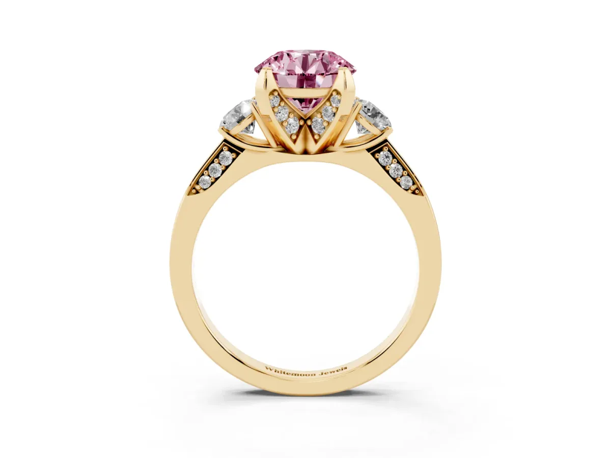Fancy Pink Round Cut Brilliant Three-Stone Diamond Ring with Pavé Band and Four-Prong Setting Yellow gold