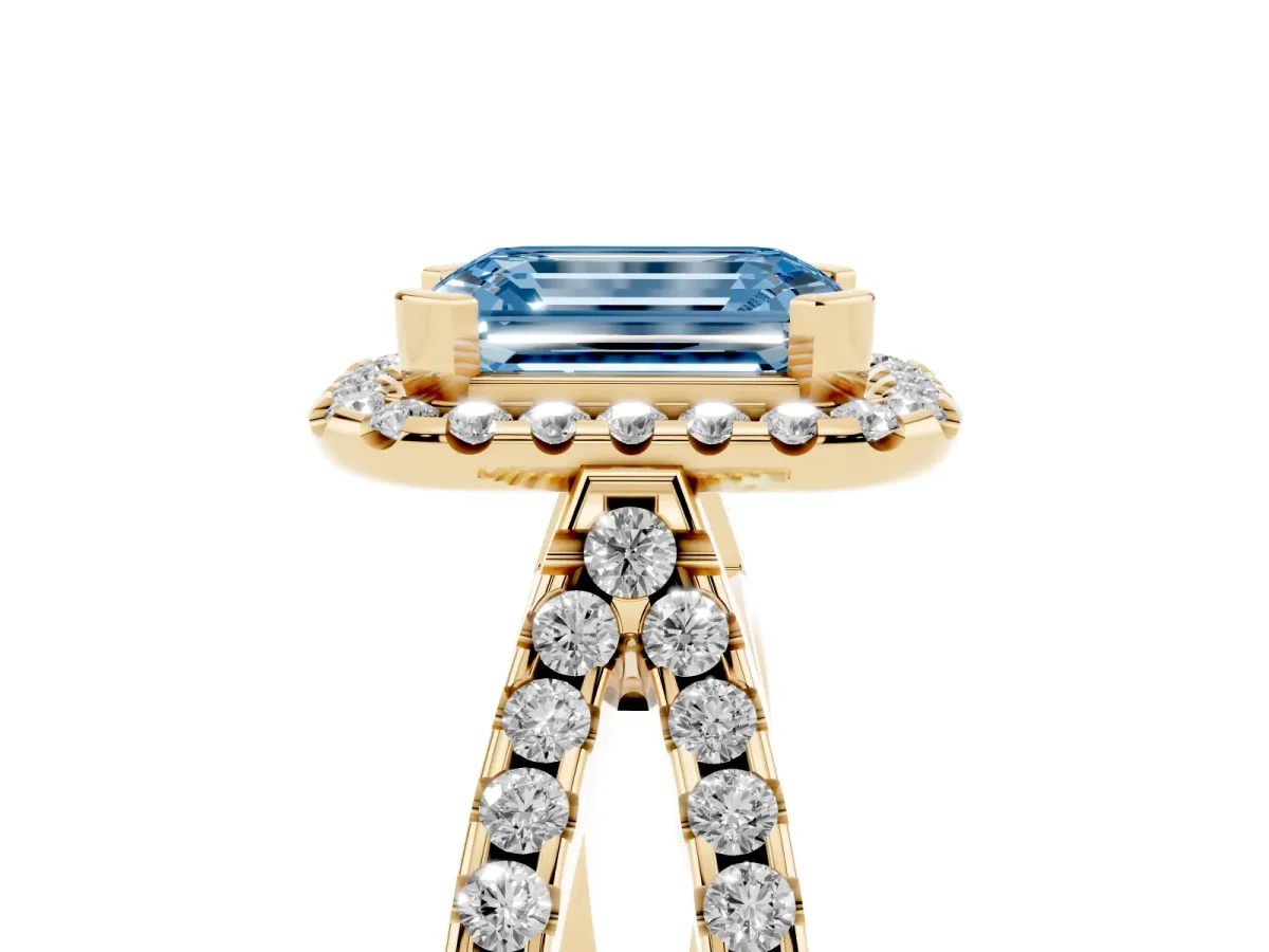 Fancy Blue Emerald Cut Diamond Halo Ring with Split Shank Pavé Band and Prong Setting Yellow gold