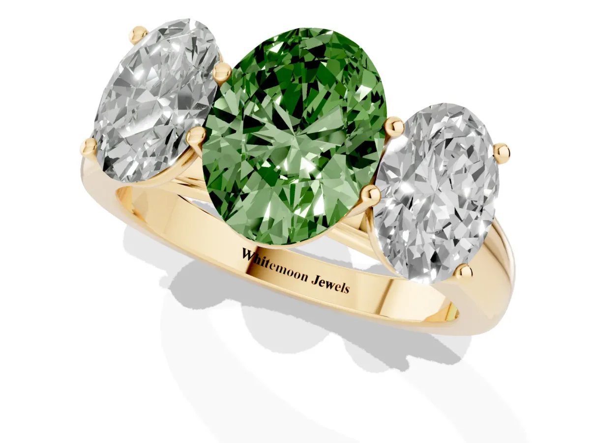 Fancy Green Oval Cut Three-Stone Diamond Ring with Prong Setting on a Classic Band Yellow gold