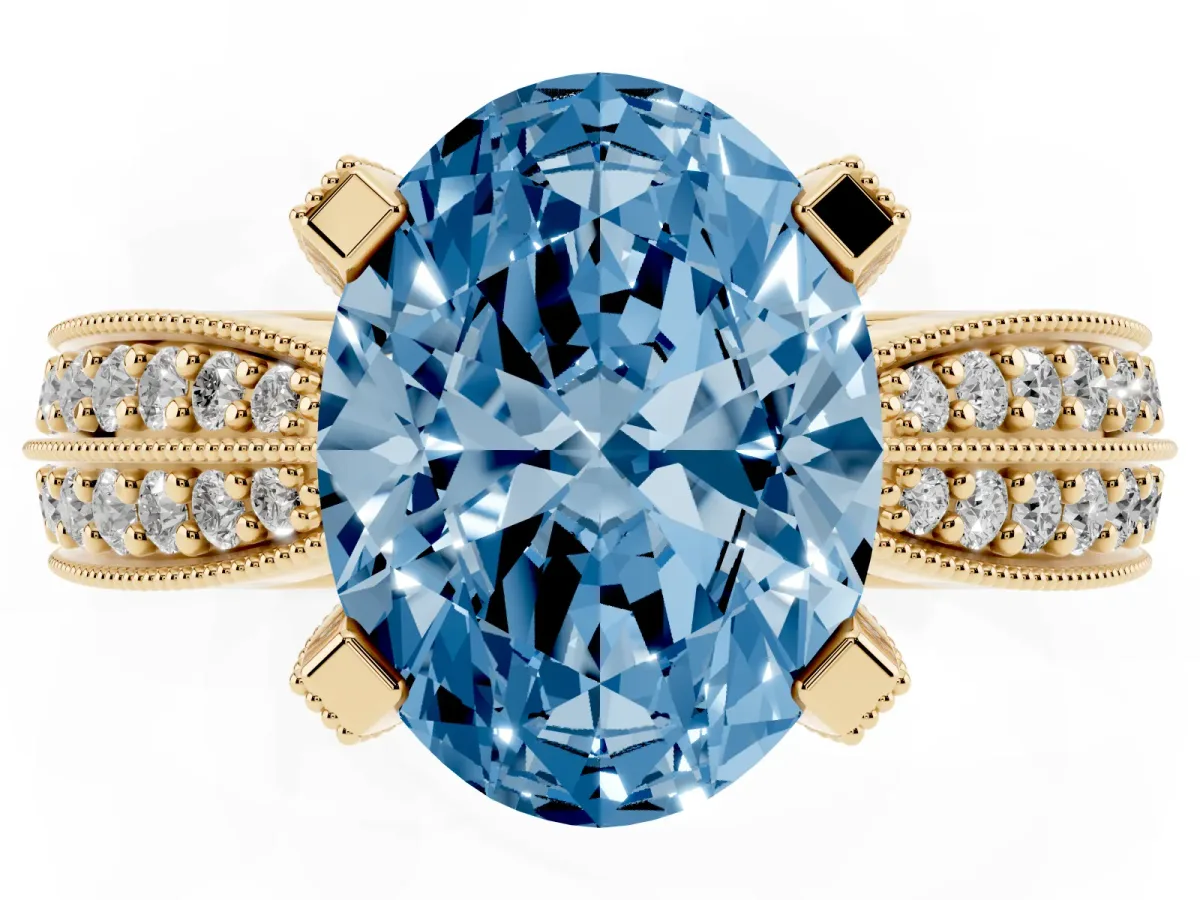 Fancy Blue Oval Cut Diamond Solitaire Ring with Milgrain Round Pavé Band and Prong Setting Yellow gold
