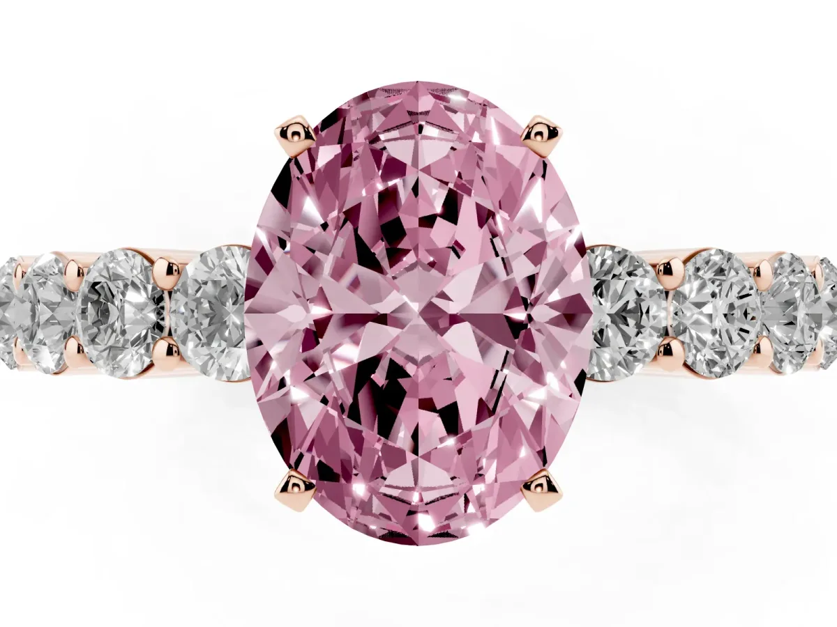 Fancy Pink Oval Cut Diamond Solitaire Ring with Shared Prong Round Side Stones Rose gold
