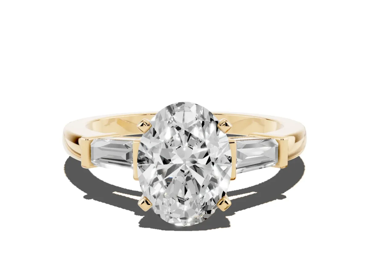 Oval Cut Cut Diamond Solitaire Ring with Tapered Baguette Accents and Four-Prong Setting Yellow gold