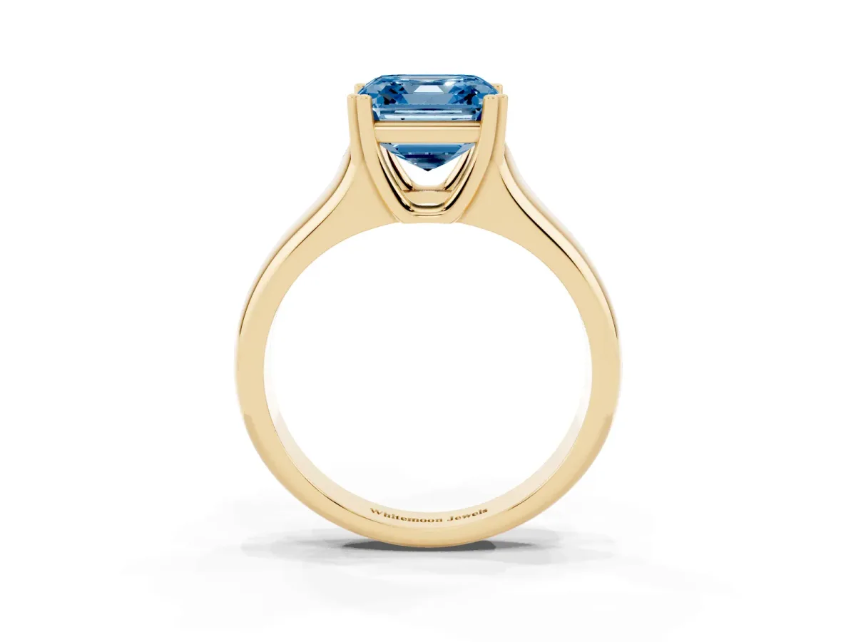 Fancy Blue Asscher Cut Diamond Solitaire Ring with Wide Band and Prong Setting Yellow gold