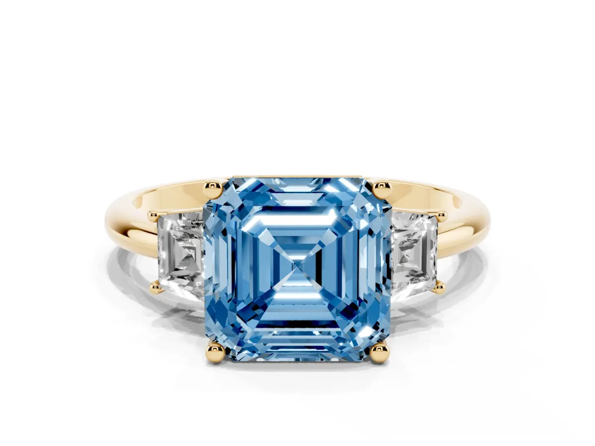 Fancy Blue Asscher Cut Diamond Three-Stone Ring with Trapezoid Side Stones and Prong Setting Yellow gold