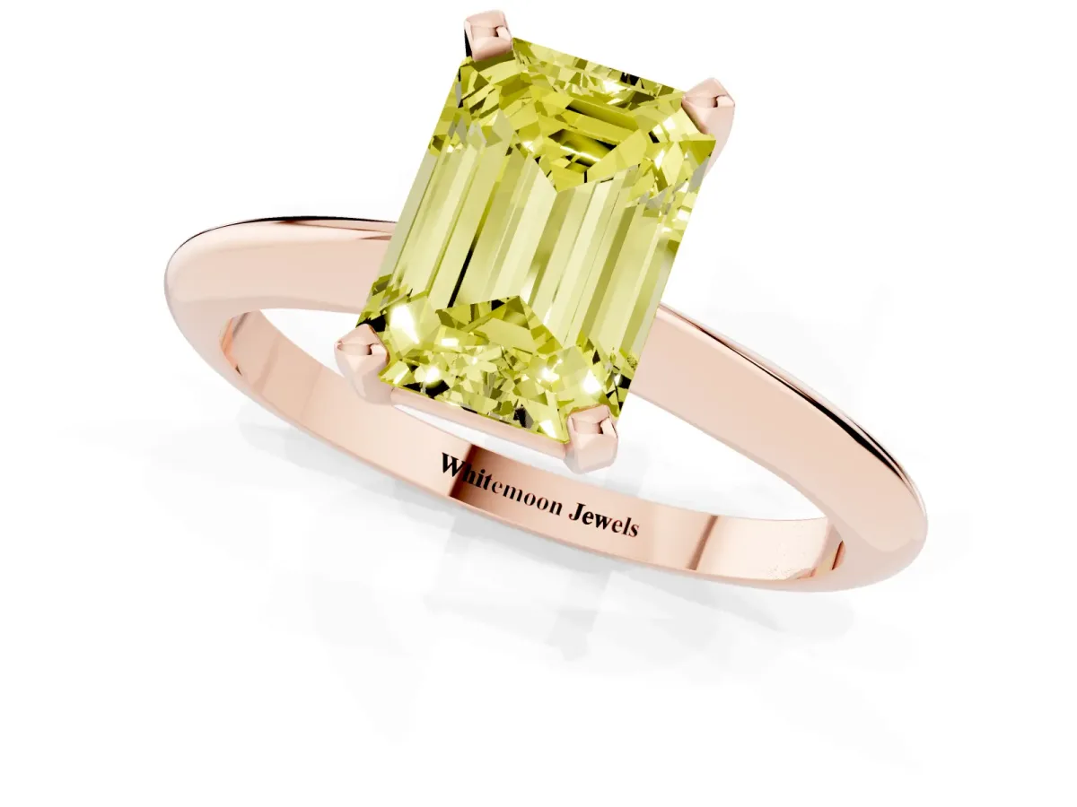 Fancy Yellow Emerald Cut Cut Solitaire Ring with Four-Prong Setting on a Classic Band Rose gold