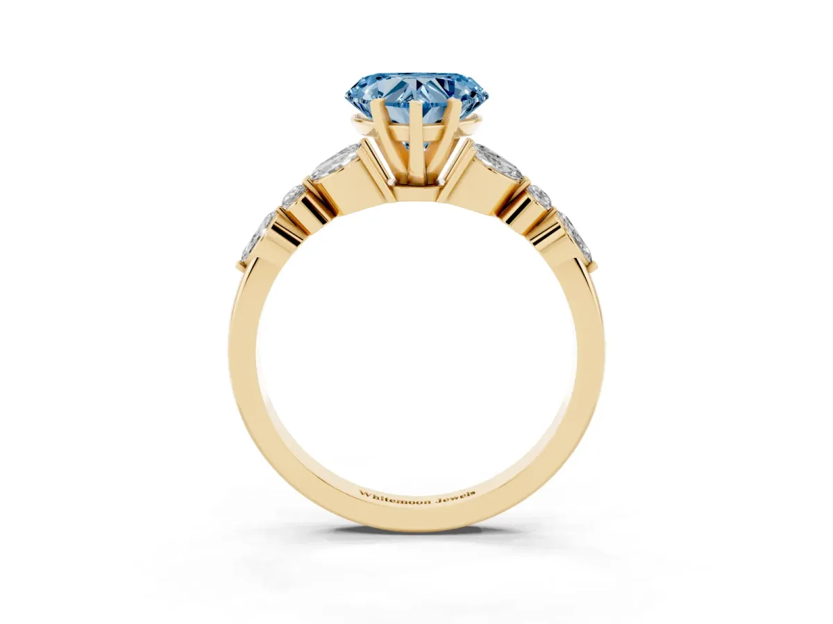 Fancy Blue Heart Cut Diamond Solitaire Ring with Side Stones and Four-Prong Setting Yellow gold