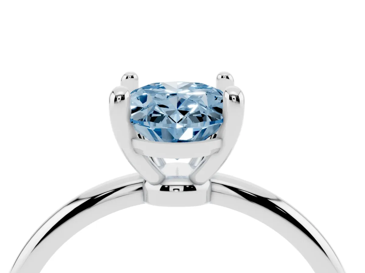Fancy Blue Oval Cut Solitaire Diamond Ring with 4-Prong Setting on a Classic Band Silver