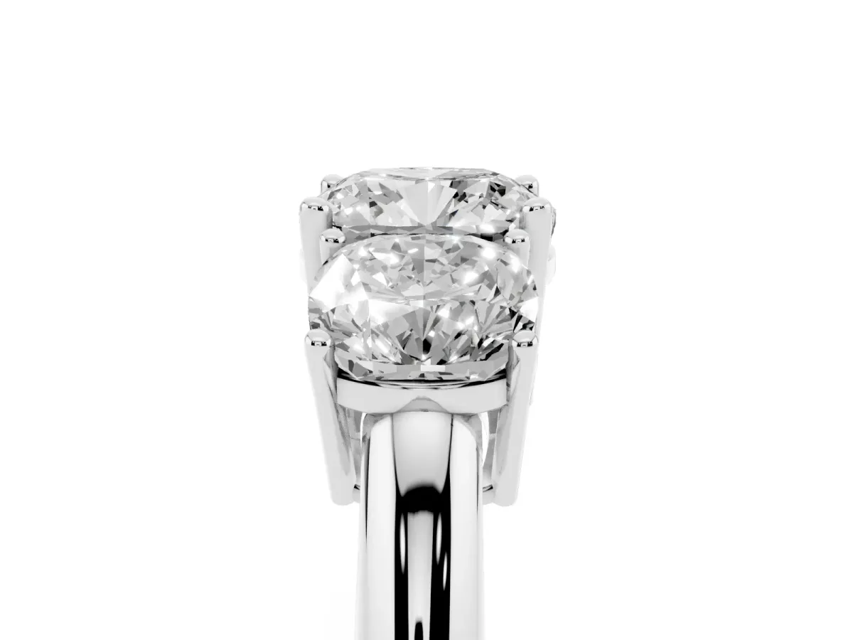 Three-Stone Cushion Cut Cut Diamond Engagement Ring with Prong Setting on a White Gold Band White gold