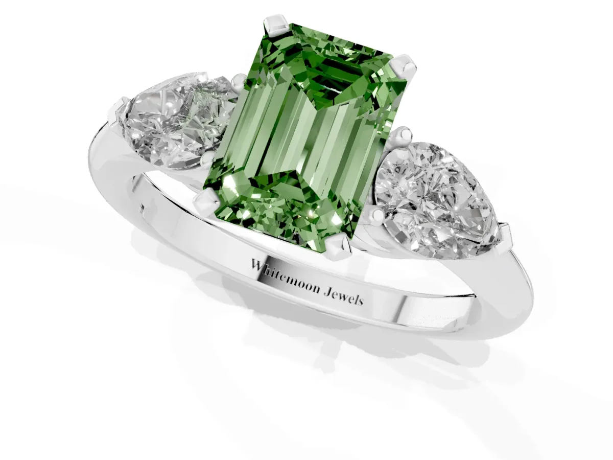 Fancy Green Three-Stone Emerald Cut Diamond Ring with Pear Side Stones and Four-Prong Setting Silver