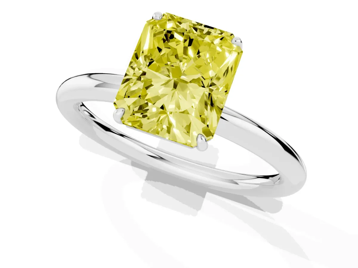Fancy Yellow Radiant Cut Solitaire Diamond Ring with Four-Prong Setting on a Plain Band Platinum