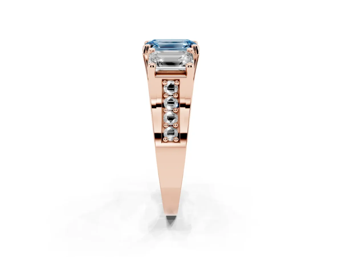 Fancy Blue Emerald Cut Diamond Three-Stone Ring with Channel Set Band and Four-Prong Setting Rose gold