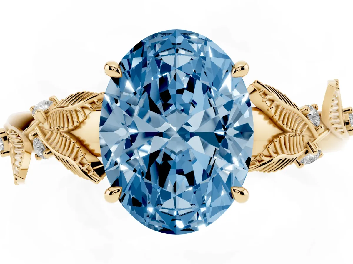 Fancy Blue Oval Cut Diamond Solitaire Ring with Leaf Motif Band and Four-Prong Setting Yellow gold