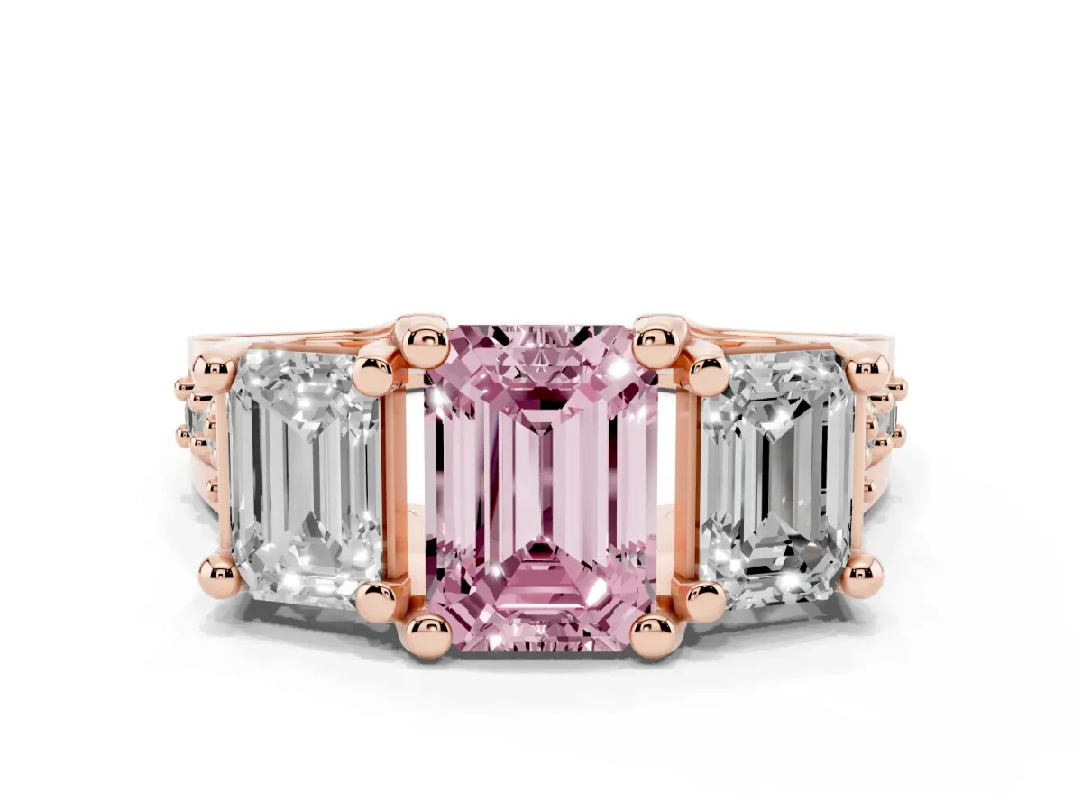 Fancy Pink Emerald Cut Diamond Three-Stone Ring with Channel Set Band and Four-Prong Setting Rose gold