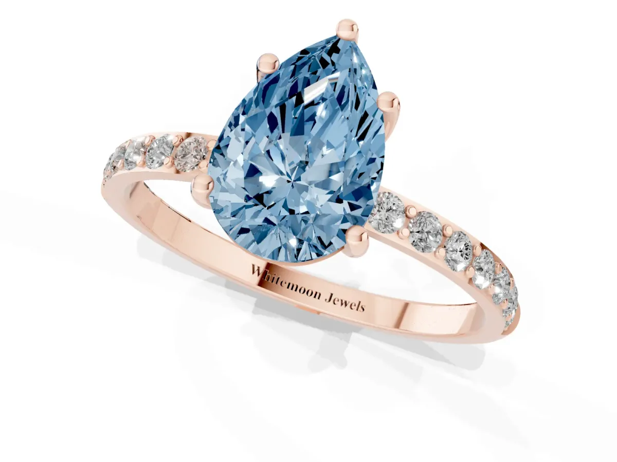 Fancy Blue Pear Cut Diamond Solitaire Ring with Round Pavé Shoulders and Prong Setting Rose gold
