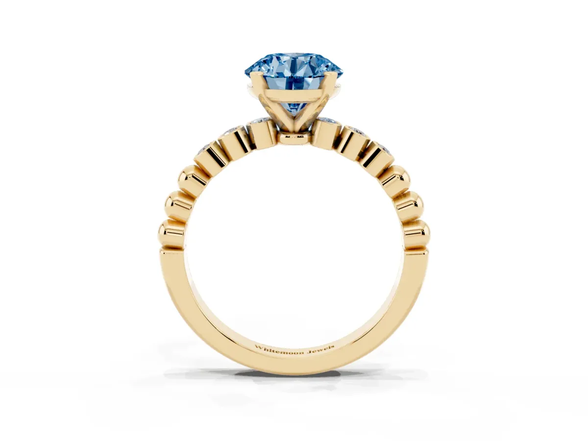 Fancy Blue Round Cut Solitaire Bezel Accent Diamond Engagement Ring with Beaded Band and Four-Prong Setting Yellow gold