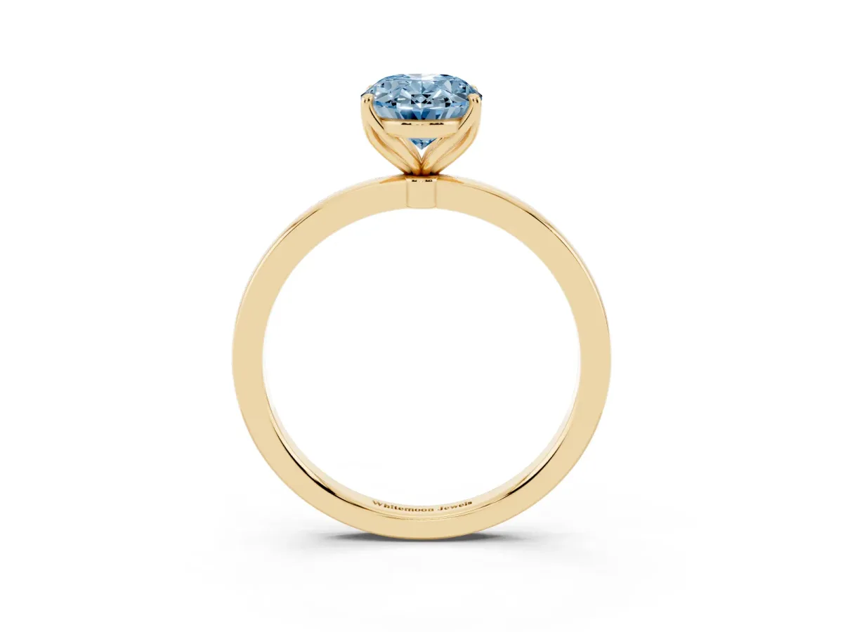 Fancy Blue Oval Cut Diamond Solitaire Ring with Thin Band and Prong Setting Yellow gold