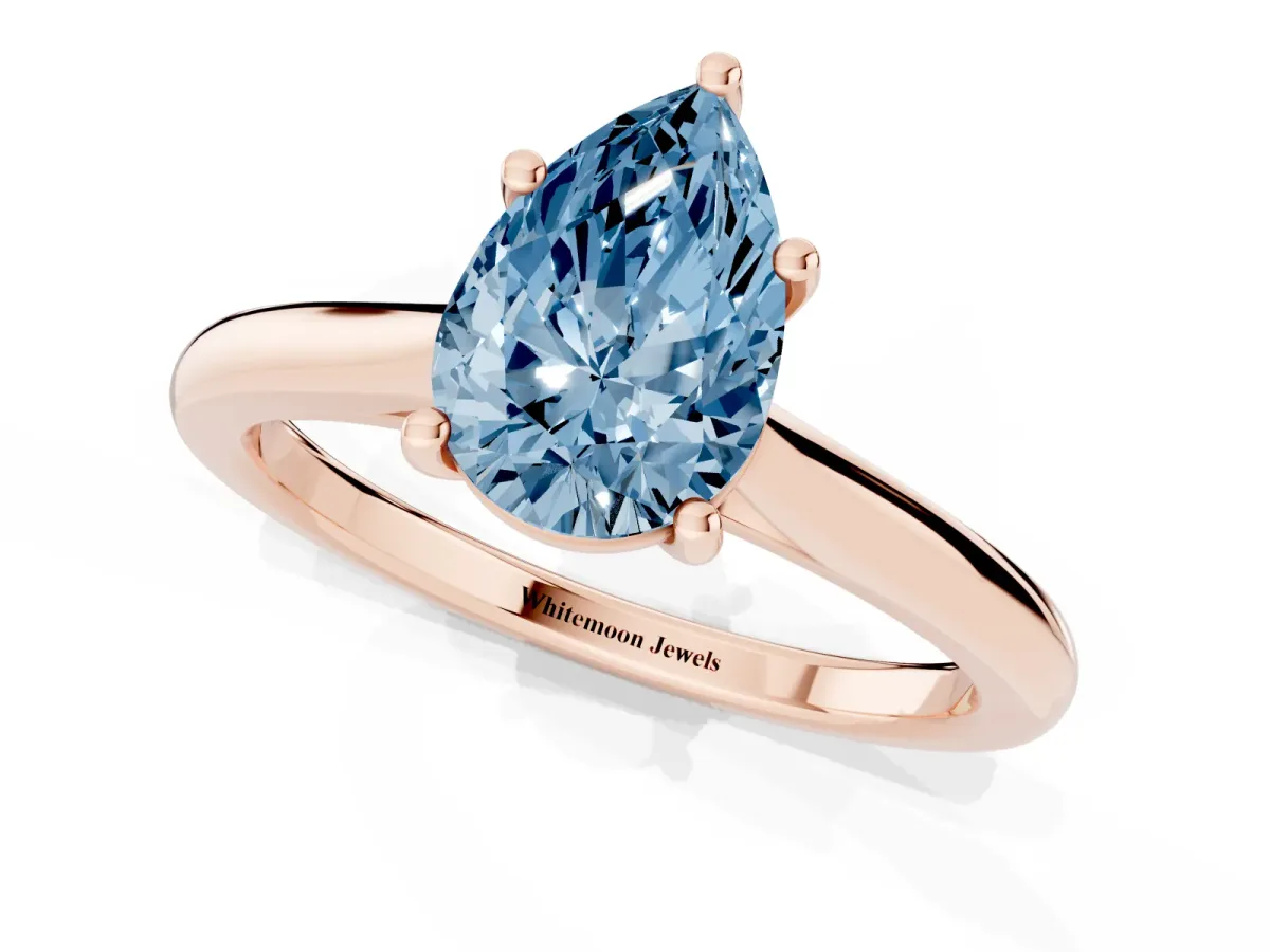 Fancy Blue Pear Cut Cut Solitaire Ring with Cathedral Band and Four-Prong Setting Rose gold