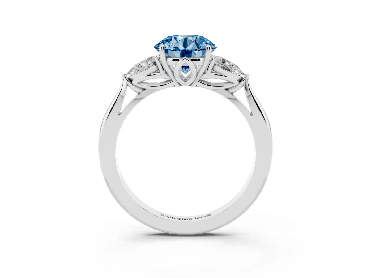 Fancy Blue Three-Stone Round Cut Diamond Ring with Pear Side Stones in Four-Prong Setting Silver
