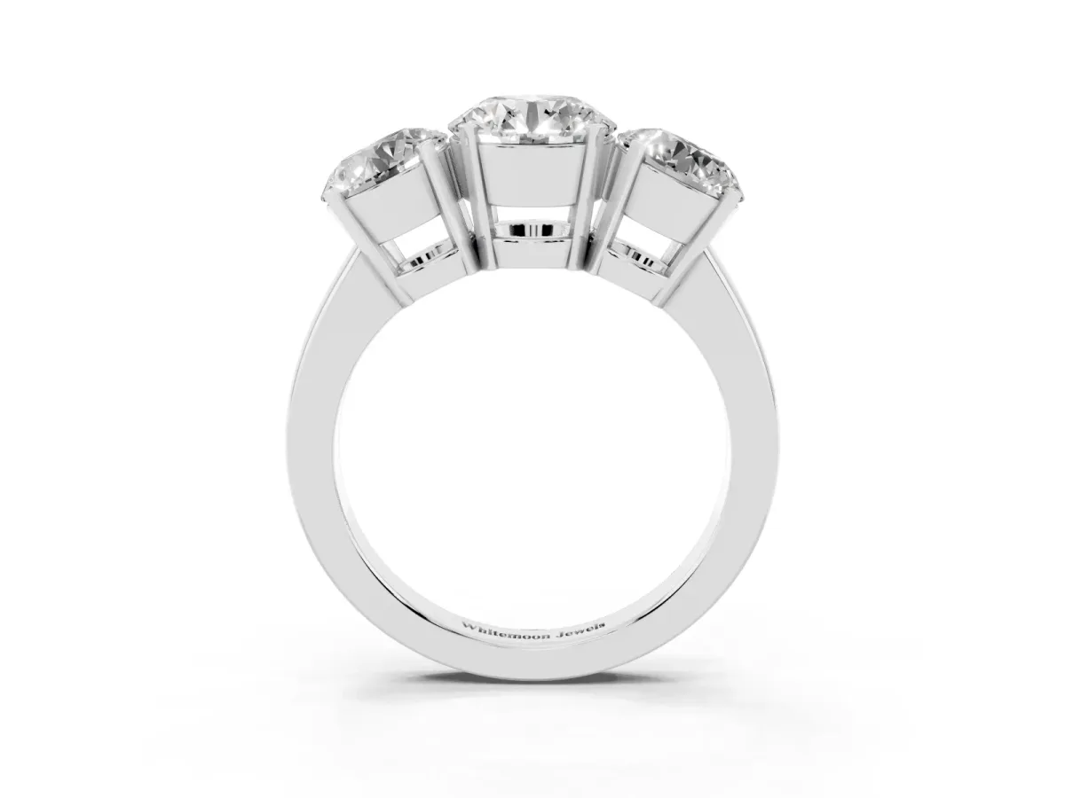 Three-Stone Round Cut Cut Diamond Ring with Channel Set Band and Four-Prong Setting Platinum