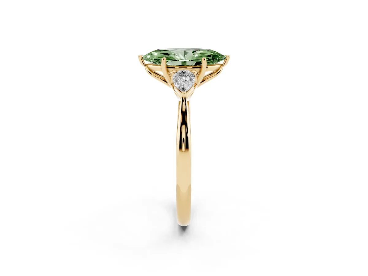 Fancy Green Three-Stone Marquise Cut Diamond Ring with Pear Side Stones in Four-Prong Setting Yellow gold