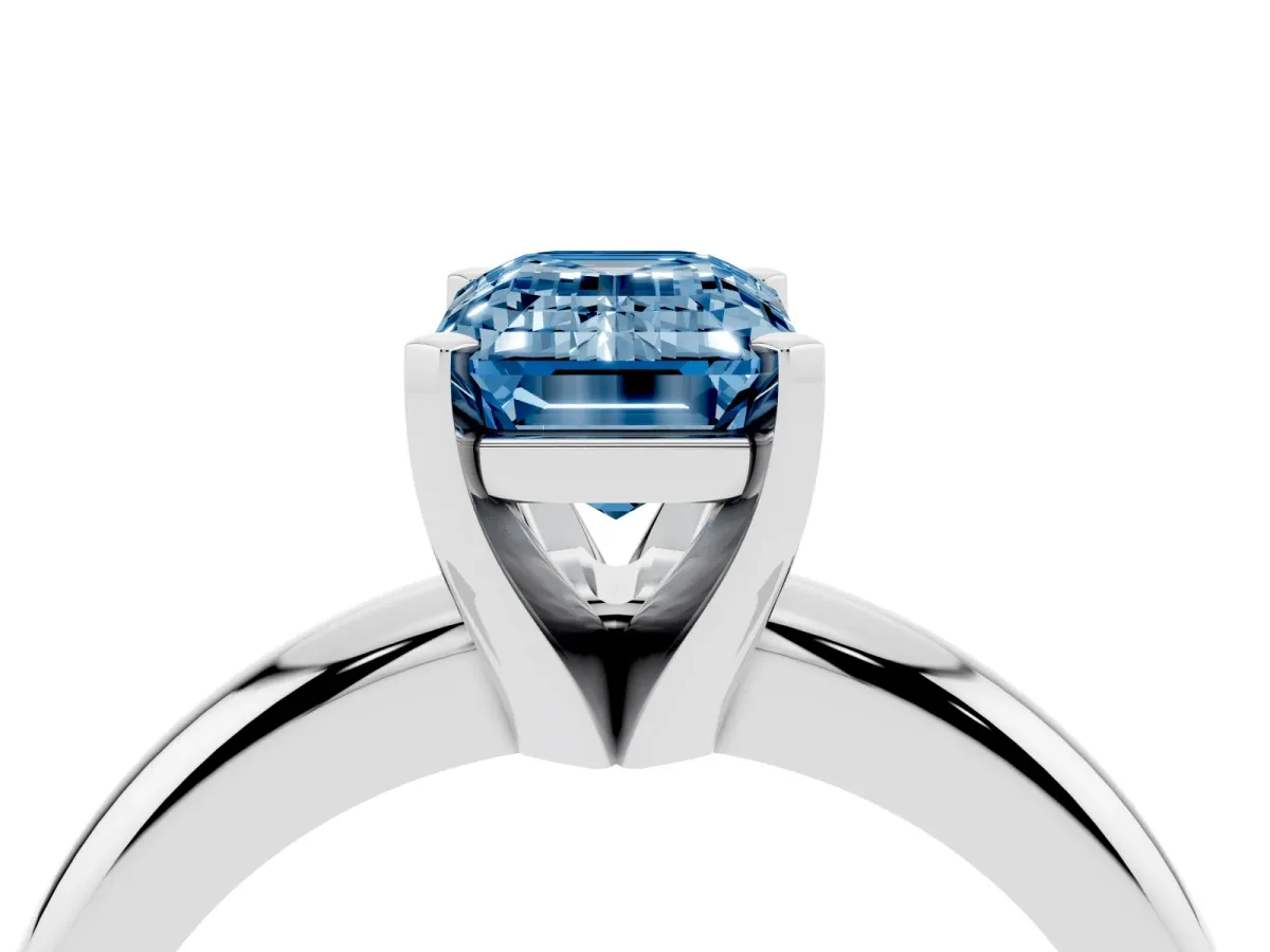 Fancy Blue Emerald Cut Diamond Solitaire Engagement Ring with Round Band and Four-Prong Setting Silver