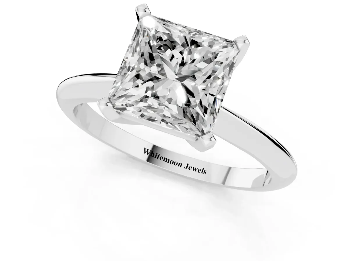 Princess Cut Cut Solitaire Ring with Four-Prong Setting on a Classic Band Platinum