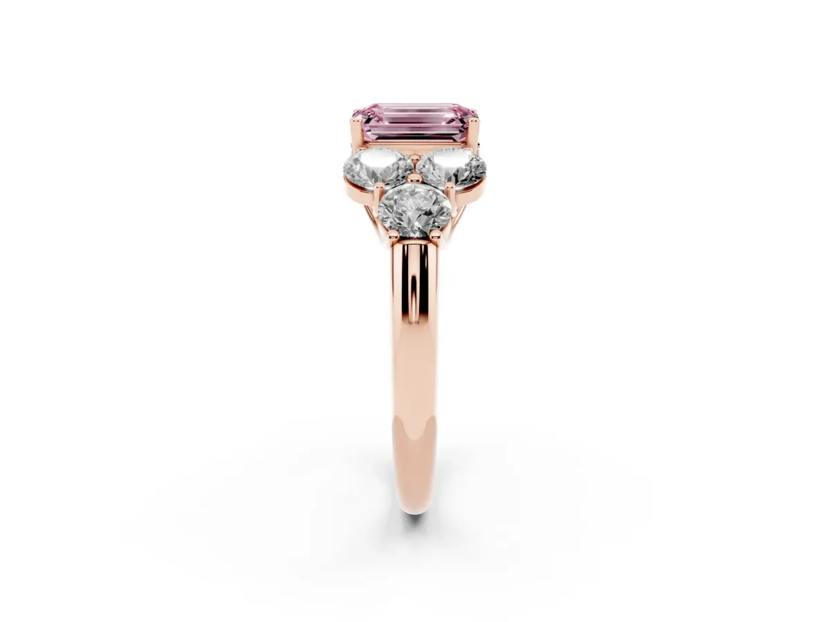 Fancy Pink Emerald Cut Cut Diamond Cluster Ring with Round Accent Stones and Prong Setting on a Classic Band Rose gold
