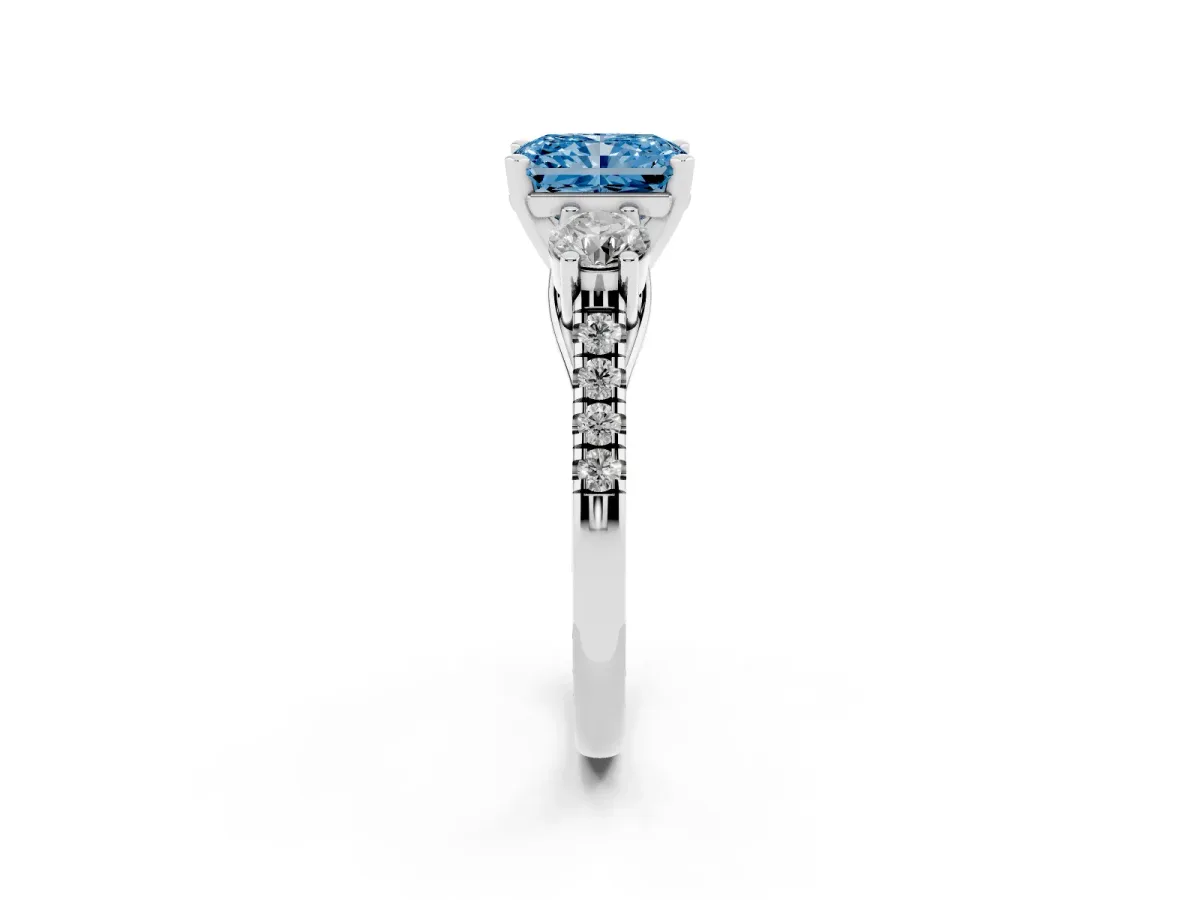 Fancy Blue Three-Stone Radiant Cut Diamond Pavé Band with Four-Prong Setting Platinum