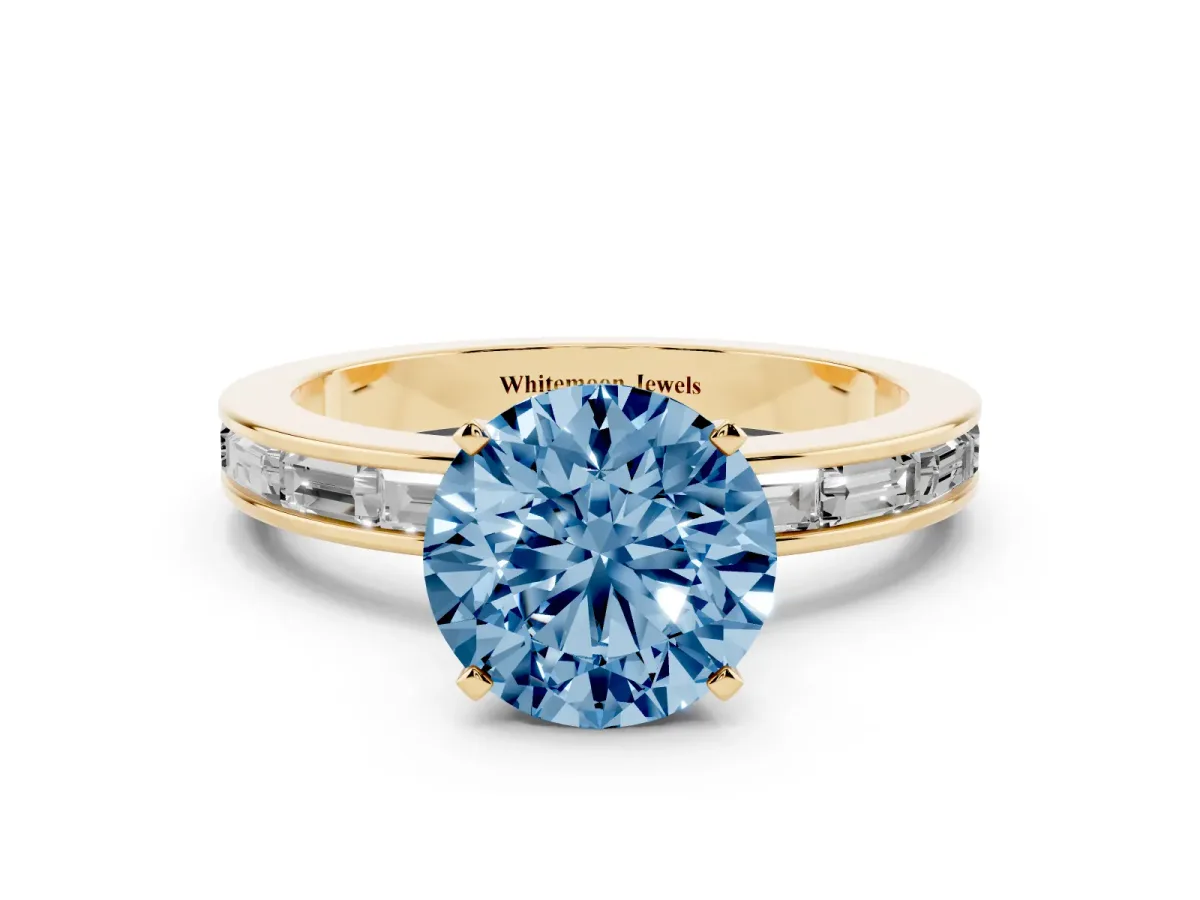 Fancy Blue Round Cut Solitaire Diamond Ring with Channel-Set Baguette Band and Four-Prong Setting Yellow gold