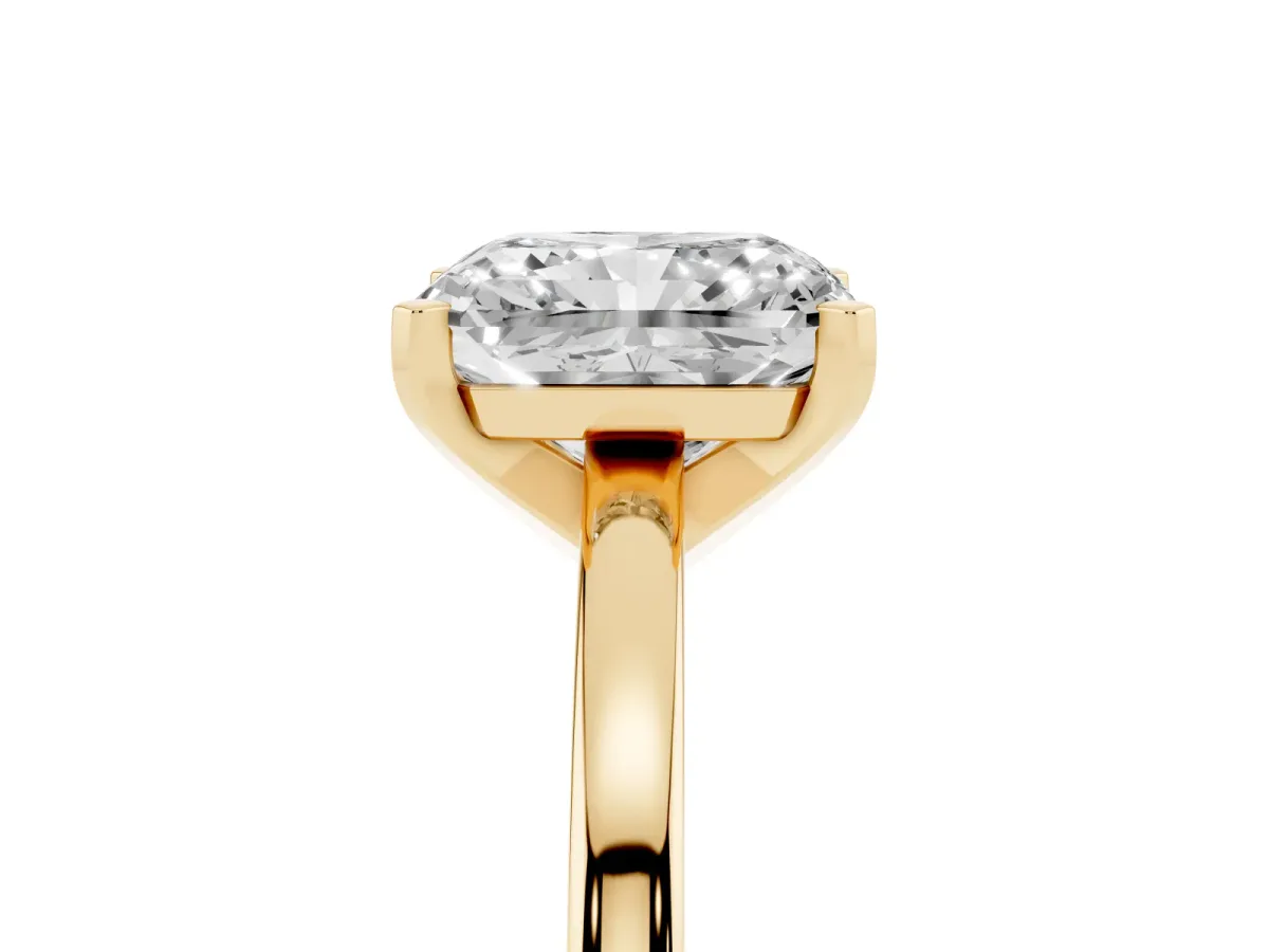 Radiant Cut Solitaire Diamond Engagement Ring with Four-Prong Setting on a Classic Band Yellow gold