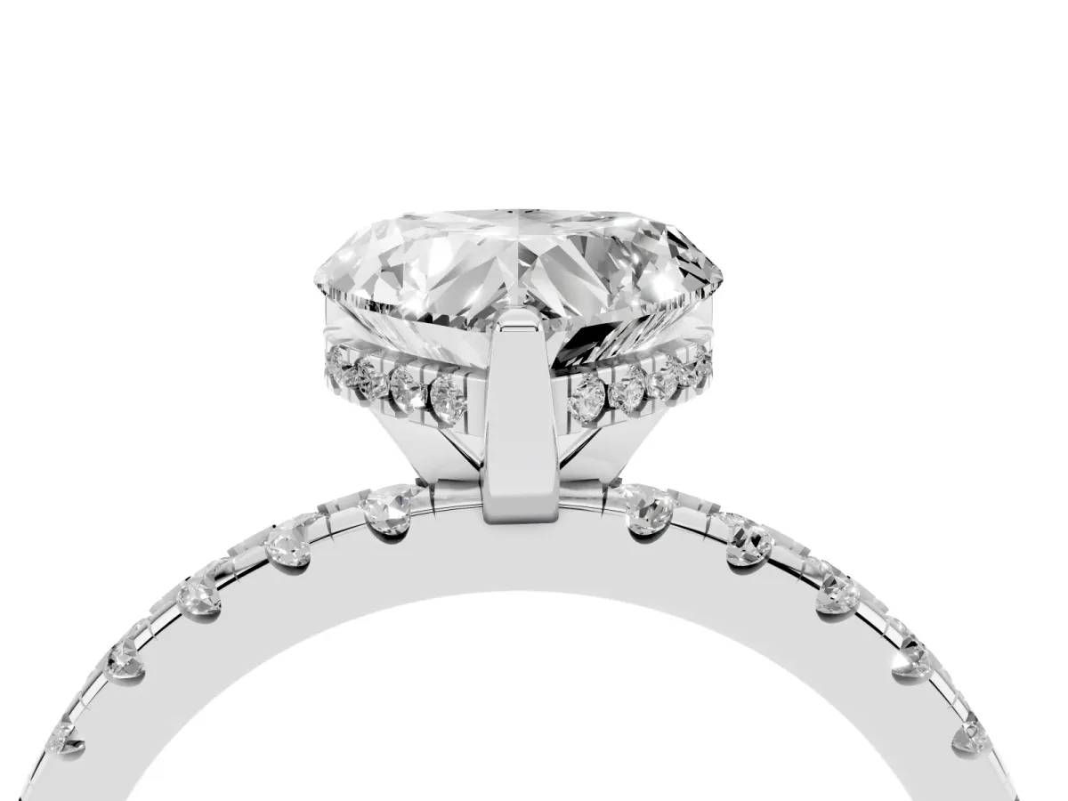 Heart Cut Diamond Solitaire Ring with Round Pavé Band and Four-Prong Setting Silver