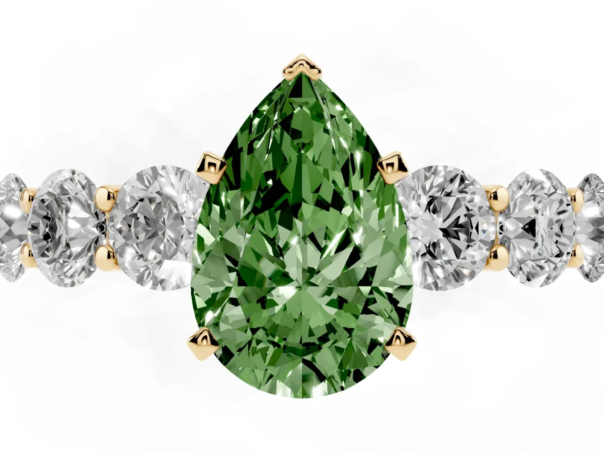 Fancy Green Pear Cut Diamond Prong Setting with Side Stones on a Pave Band Yellow gold