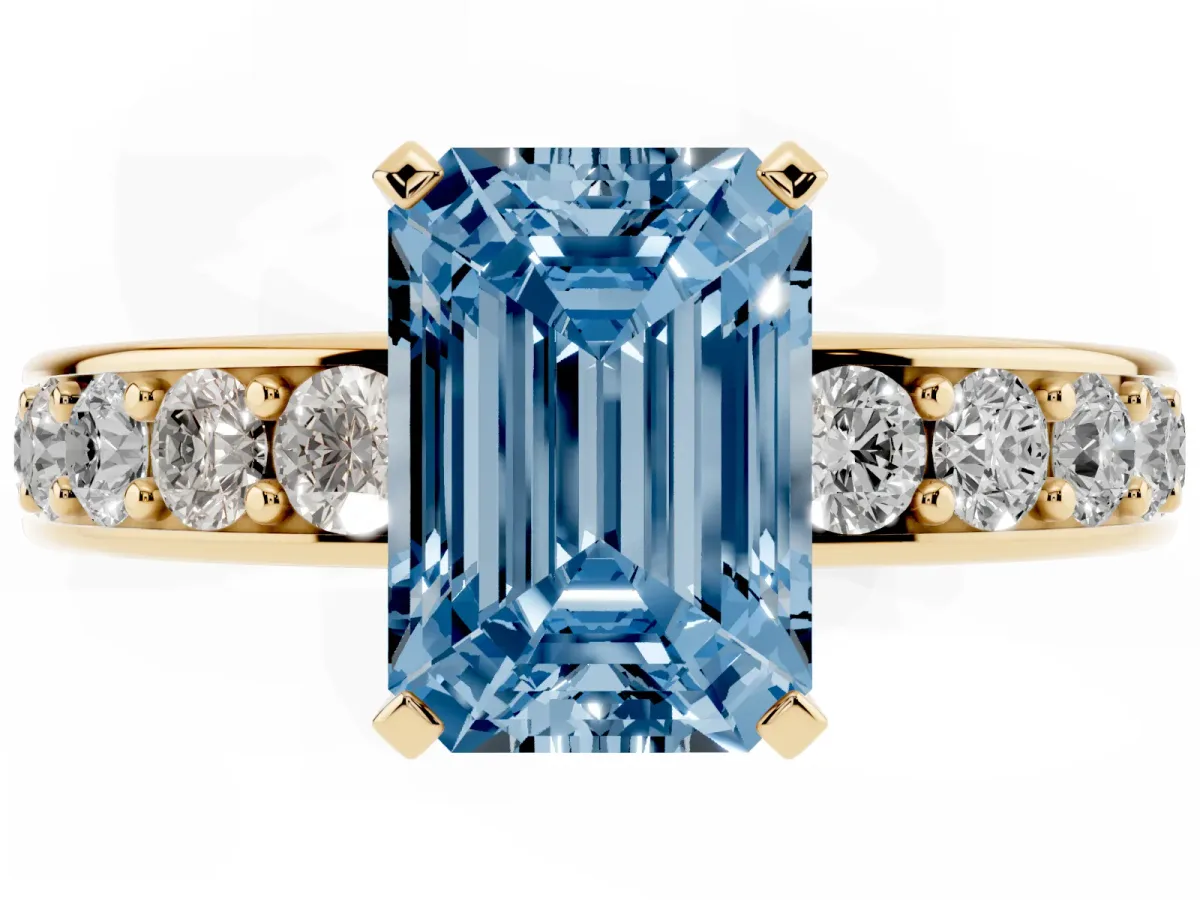 Fancy Blue Emerald Cut Diamond Engagement Ring with Channel Set Round Band and Prong Setting Yellow gold
