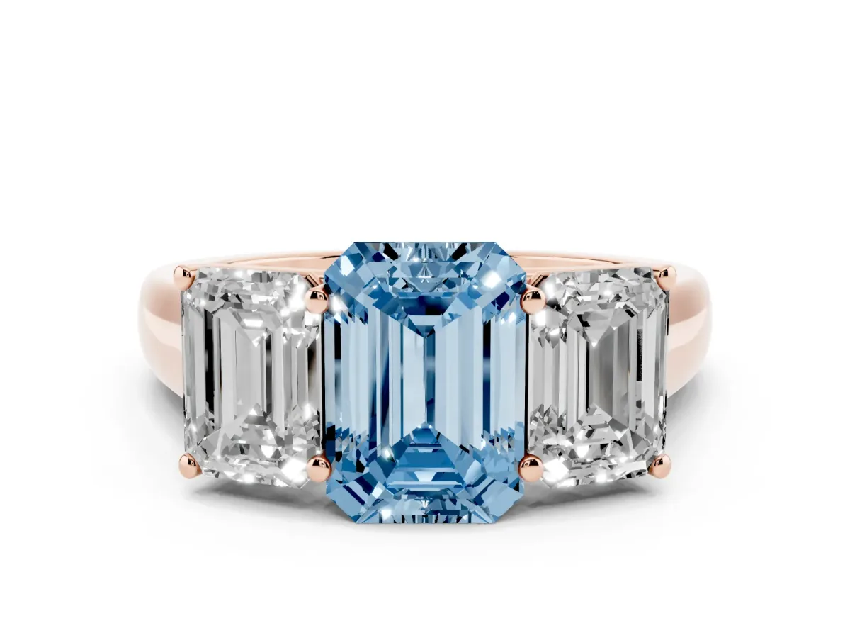Fancy Blue Emerald Cut Three-Stone Diamond Ring with Prong Setting on a Classic Band Rose gold