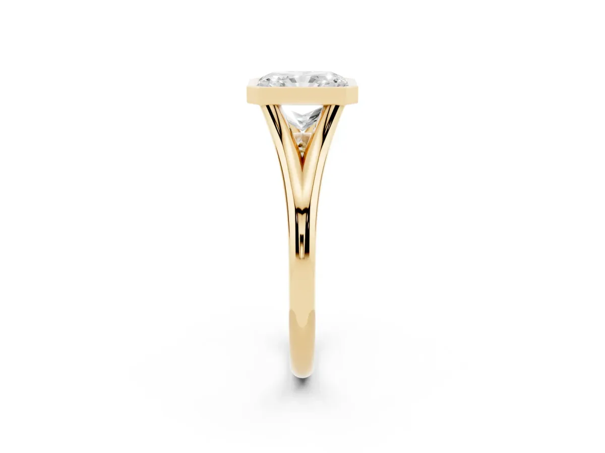 Bezel Set Radiant Cut Cut Solitaire Ring with Tapered Band Yellow gold