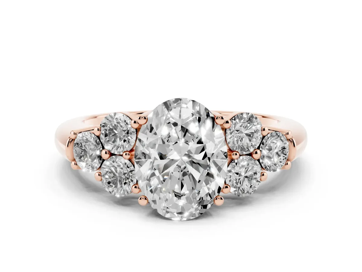 Oval Cut Cut Diamond Cluster Ring with Round Accent Stones and Prong Setting on a Classic Band Rose gold