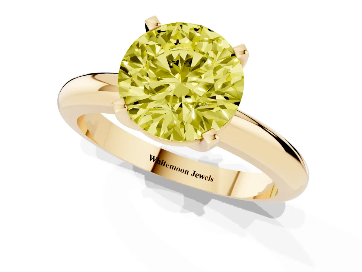 Fancy Yellow Round Cut Diamond Solitaire Engagement Ring with Round Band and Four-Prong Setting Yellow gold